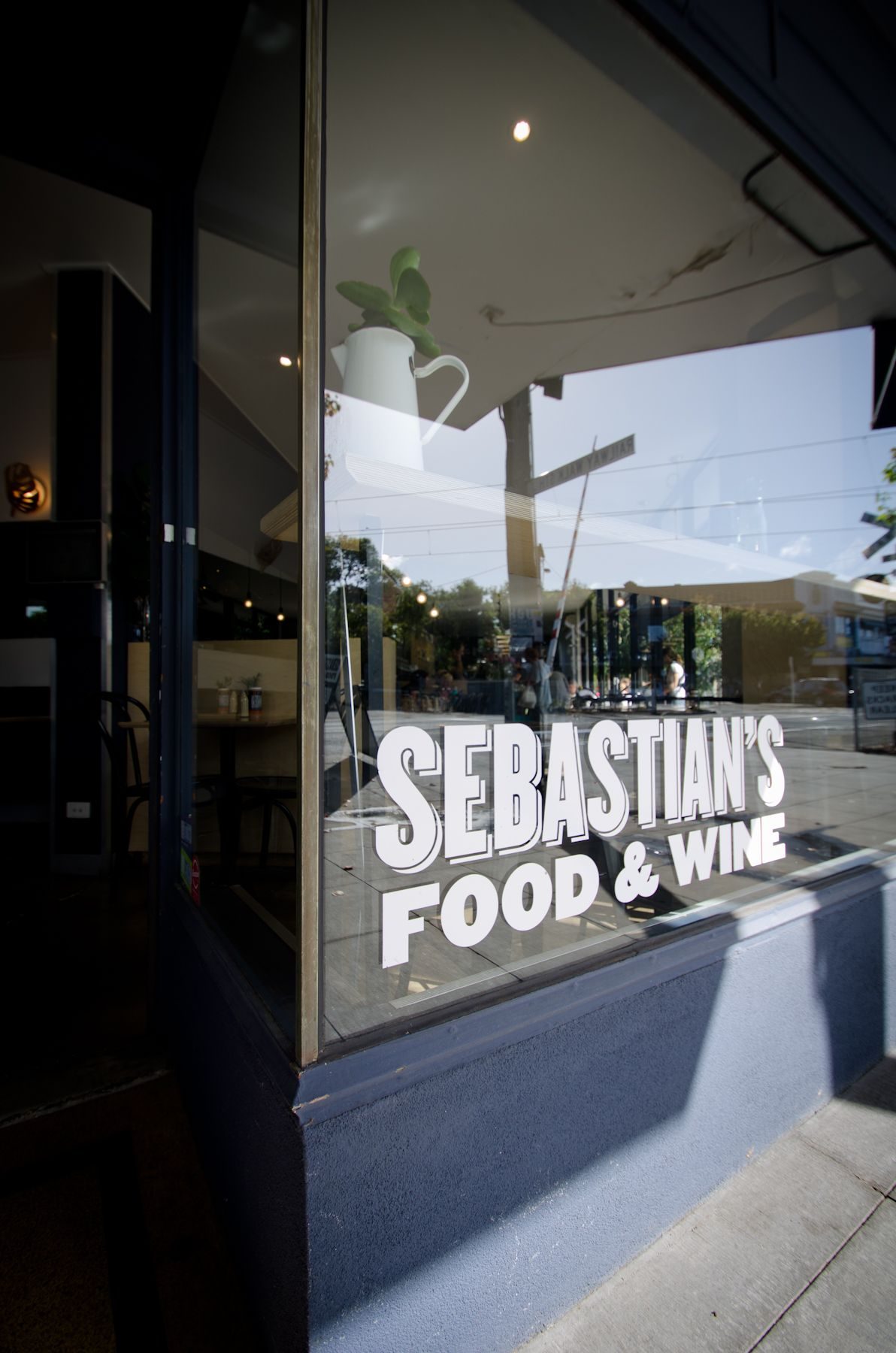 The Sebastian's Food and Wine sign on the corner window